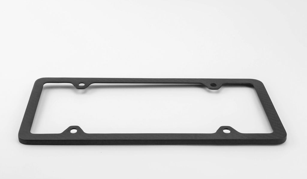Side view of the Ultimate Carbon Fiber License Plate Frame against a white background